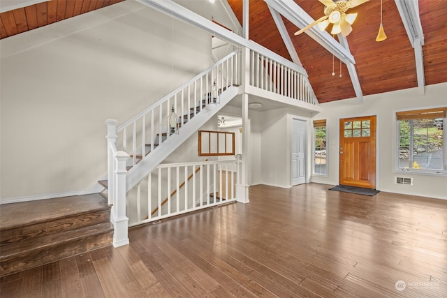 interior space featuring wood ceiling, dark hardwood / wood-style floors, and high vaulted ceiling