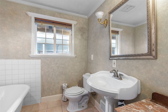 bathroom featuring ornamental molding, tile patterned flooring, toilet, and a washtub