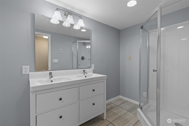 bathroom featuring walk in shower, vanity, and hardwood / wood-style floors