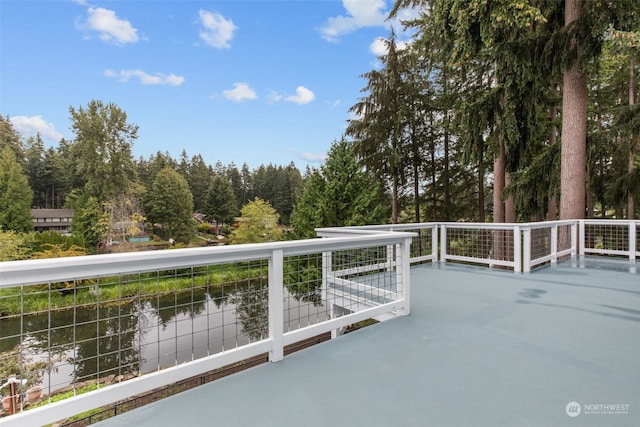 view of patio / terrace featuring a balcony and a water view