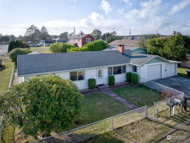 ranch-style house with a garage and a front lawn