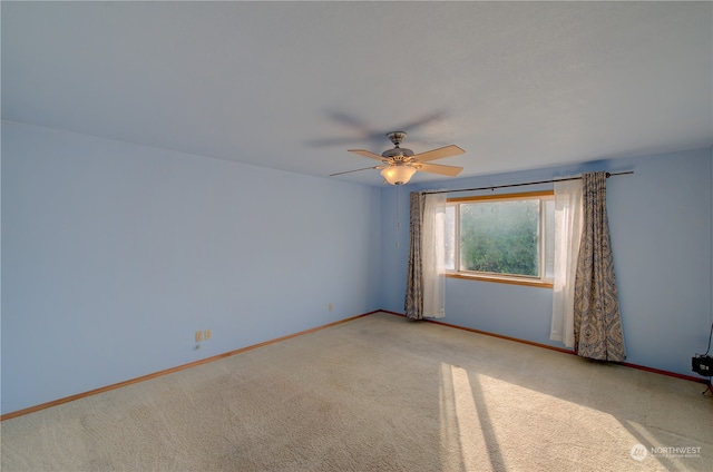 carpeted empty room with ceiling fan