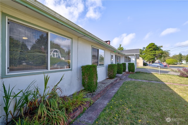 view of property exterior featuring a yard