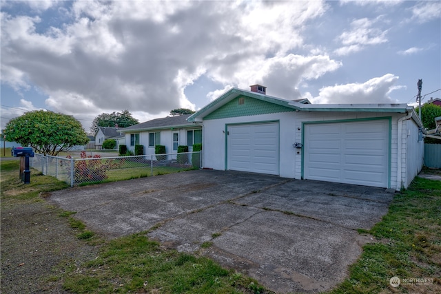 ranch-style home featuring a garage