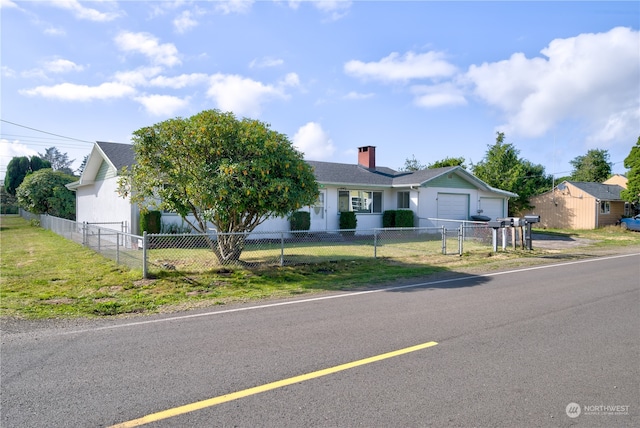 single story home featuring a garage