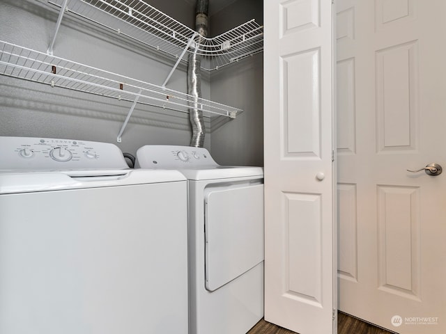 laundry room featuring dark hardwood / wood-style floors and independent washer and dryer