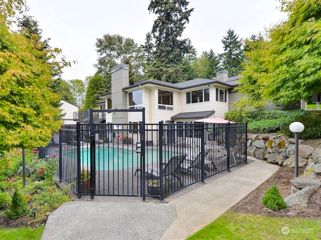 view of gate featuring a fenced in pool