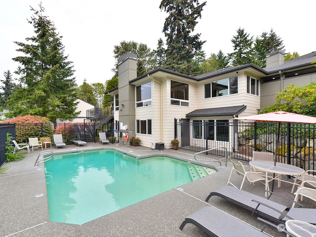 view of swimming pool featuring a patio area