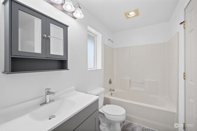 full bathroom with vanity, toilet, washtub / shower combination, and hardwood / wood-style flooring