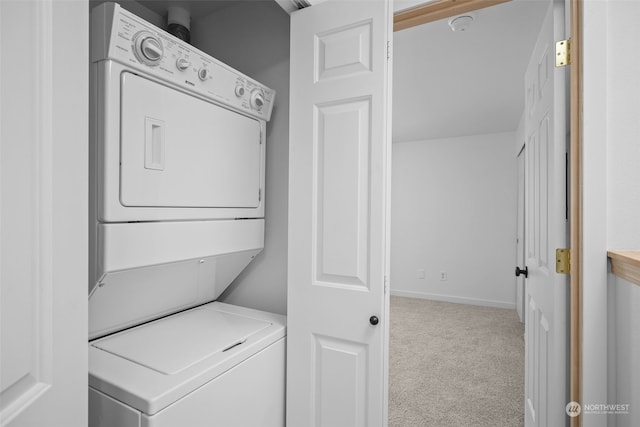 washroom featuring light carpet and stacked washer and clothes dryer