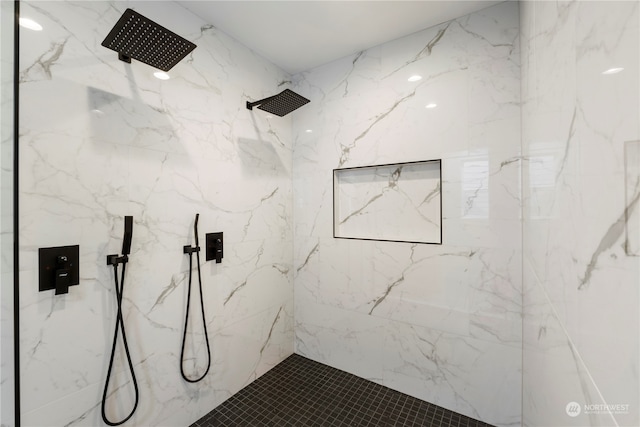 bathroom featuring a tile shower