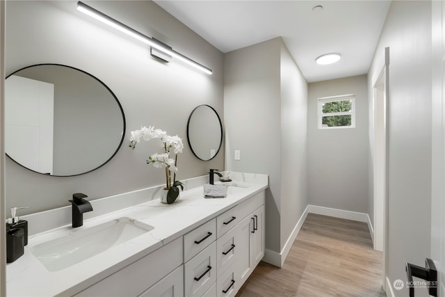 bathroom with vanity and hardwood / wood-style flooring