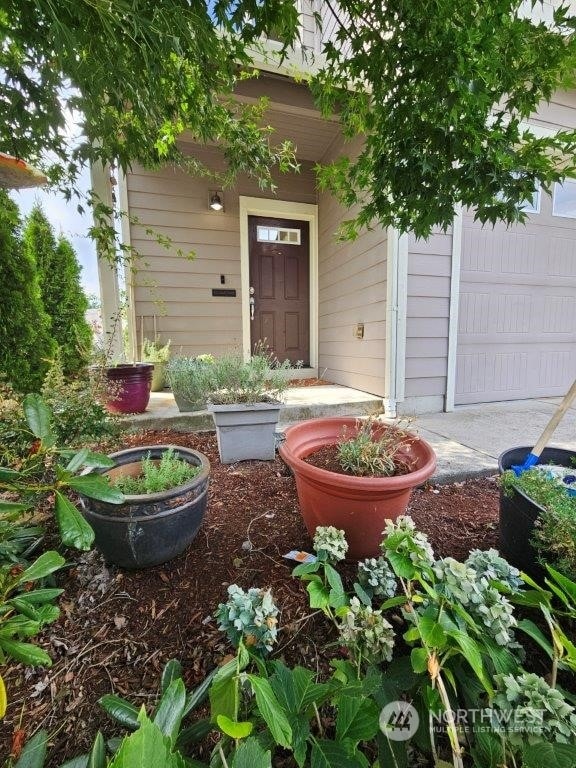 property entrance featuring a garage