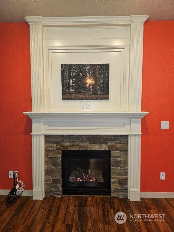 interior details with hardwood / wood-style flooring and a fireplace