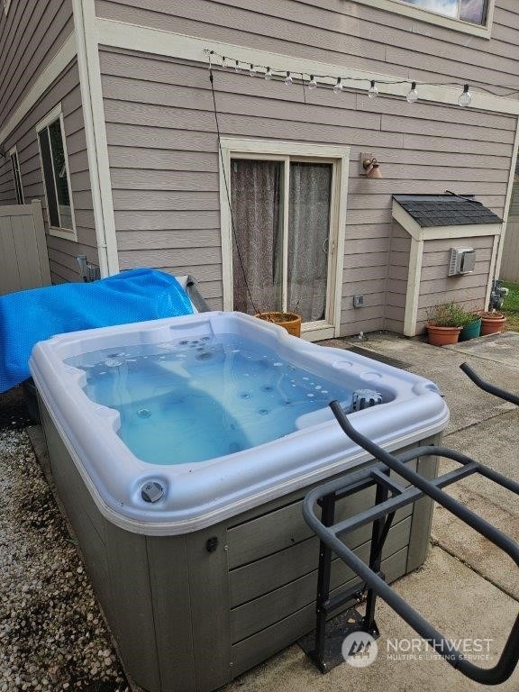 view of patio / terrace with a hot tub