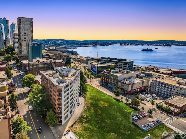 aerial view at dusk with a water view