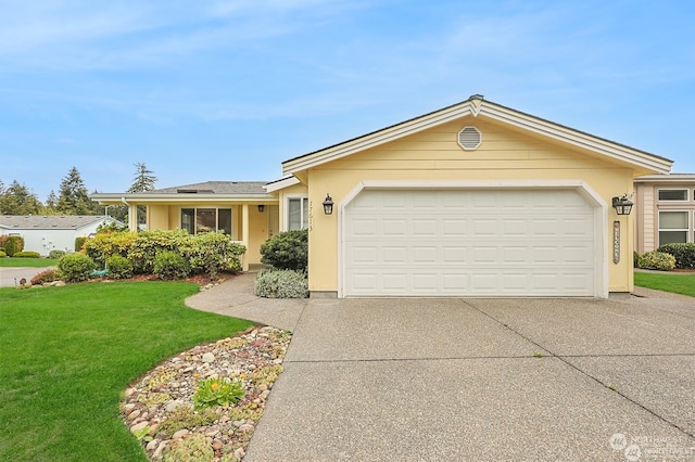 single story home with a front yard and a garage