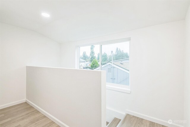 hall with light hardwood / wood-style floors