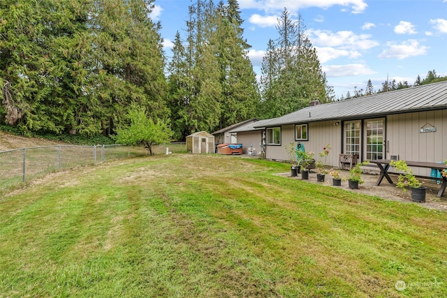 view of yard featuring a storage unit