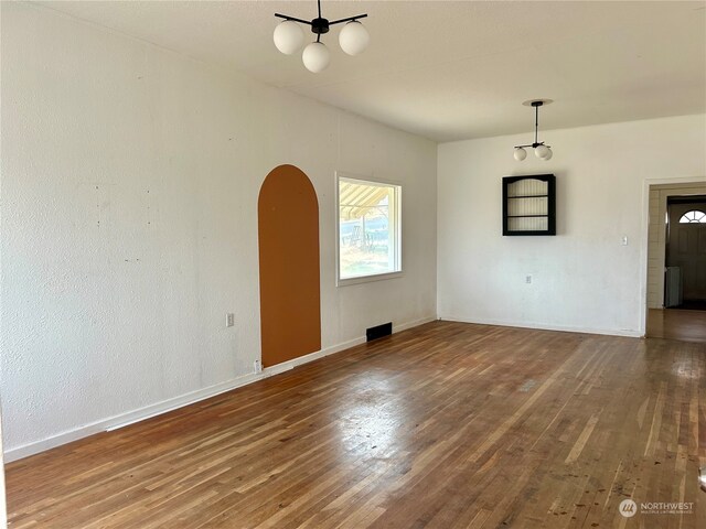 unfurnished living room featuring hardwood / wood-style flooring