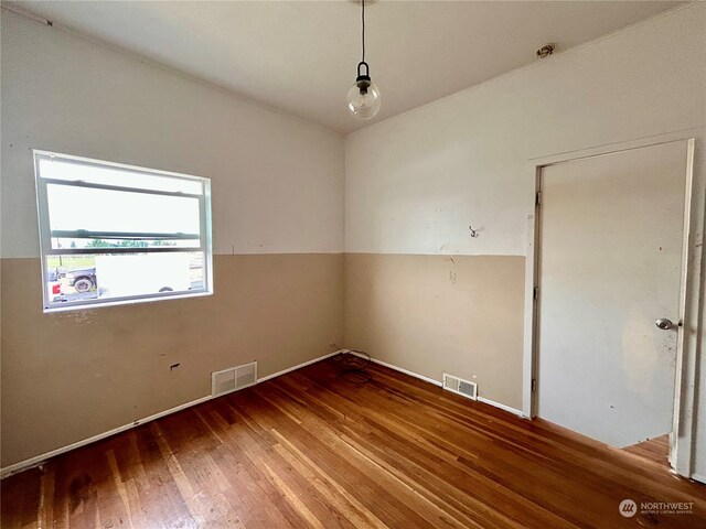 empty room featuring hardwood / wood-style floors