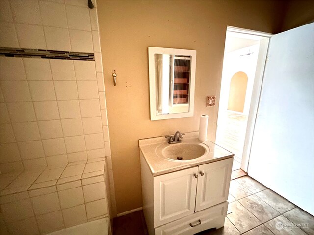 bathroom with tile patterned floors and vanity