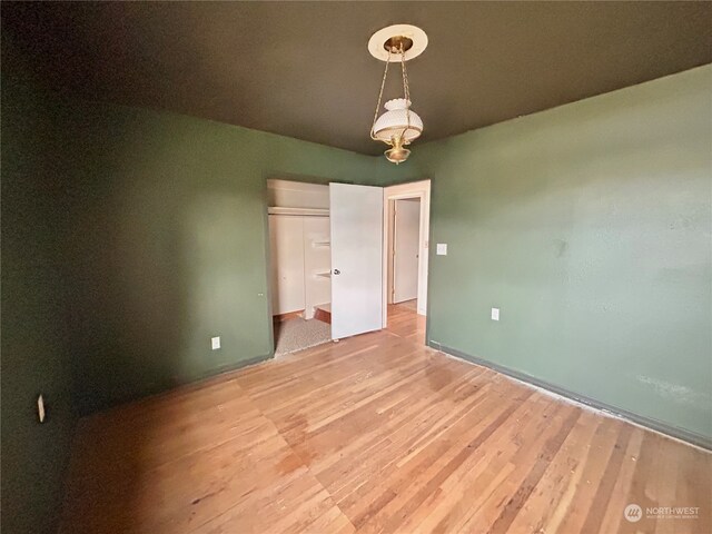 unfurnished room with light hardwood / wood-style floors