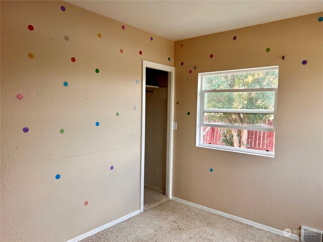 unfurnished bedroom with light carpet