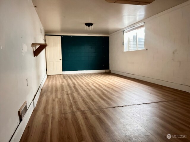 empty room with wood-type flooring