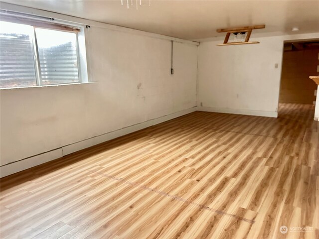 spare room featuring light wood-type flooring