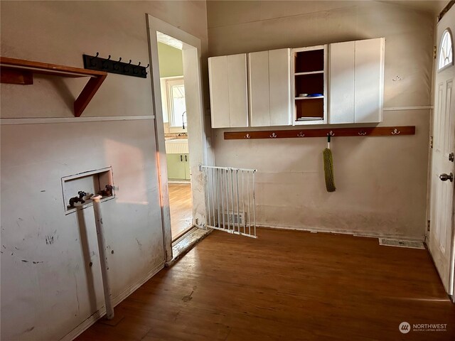 laundry area featuring hookup for a washing machine and dark hardwood / wood-style floors