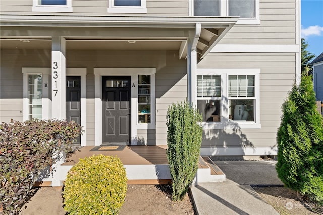 doorway to property featuring a porch