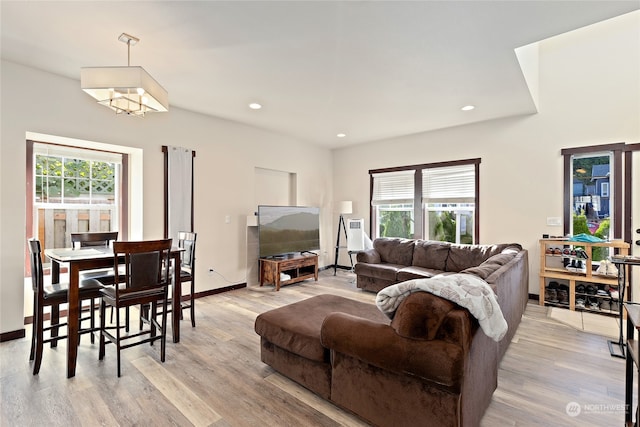 living room with light hardwood / wood-style flooring