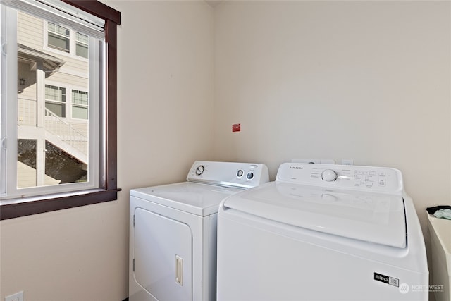 laundry area with separate washer and dryer