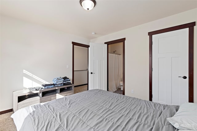 carpeted bedroom with connected bathroom