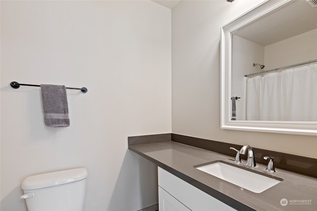 bathroom with vanity, toilet, and a shower with shower curtain