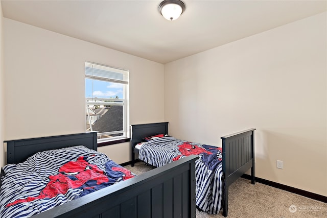 bedroom with light colored carpet