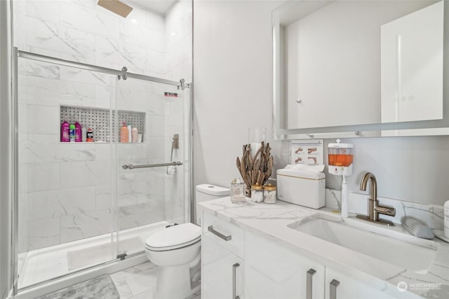 1217 S 273rd Pl, Des Moines, WA 98198 - full bath featuring marble look tiles, toilet, a shower stall, and vanity