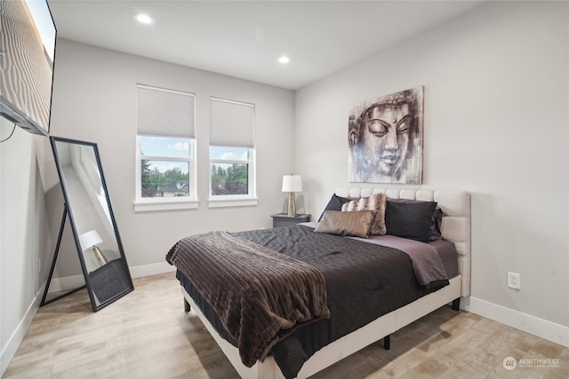 bedroom with light hardwood / wood-style floors