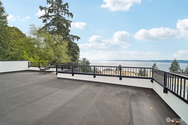 wooden deck with a water view