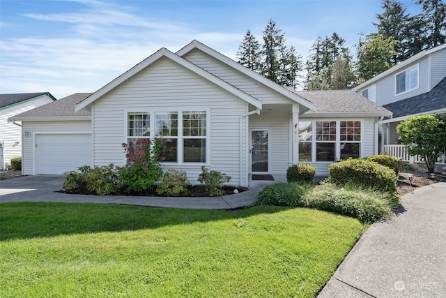 single story home with a front yard and a garage