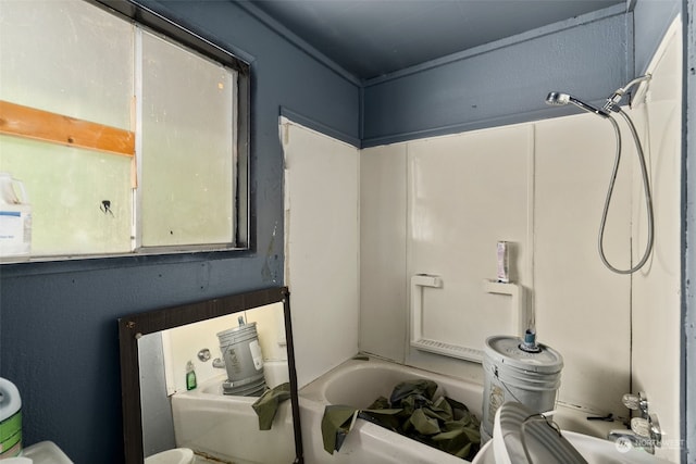 bathroom with tub / shower combination and toilet