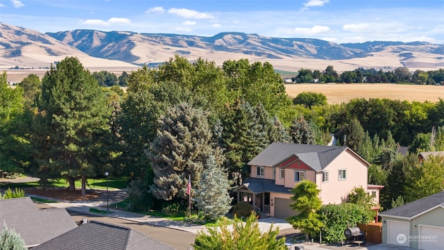 birds eye view of property featuring a mountain view