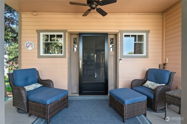 view of exterior entry featuring ceiling fan