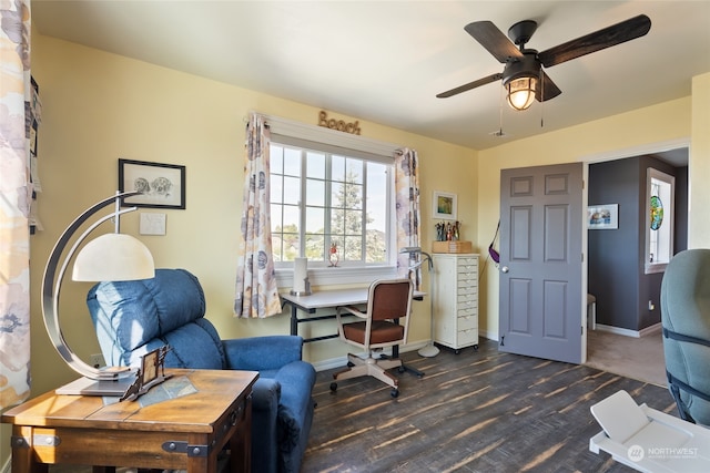 office area with dark wood-type flooring and ceiling fan