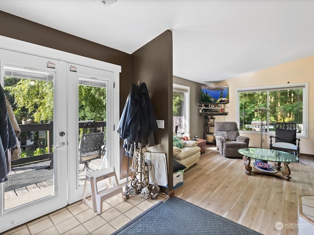 living room with light hardwood / wood-style floors and french doors