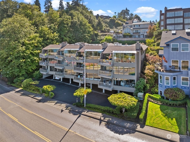 view of building exterior featuring uncovered parking