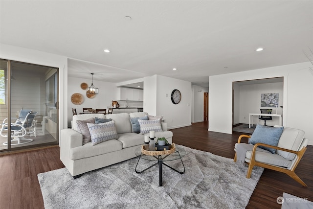 living room with wood finished floors, recessed lighting, and baseboards