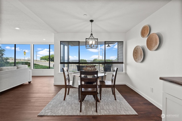 dining room with dark wood finished floors, baseboards, a chandelier, and recessed lighting