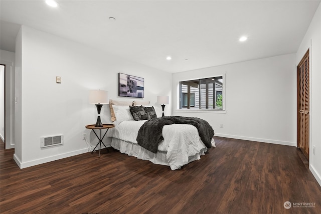 bedroom with wood finished floors, baseboards, and recessed lighting